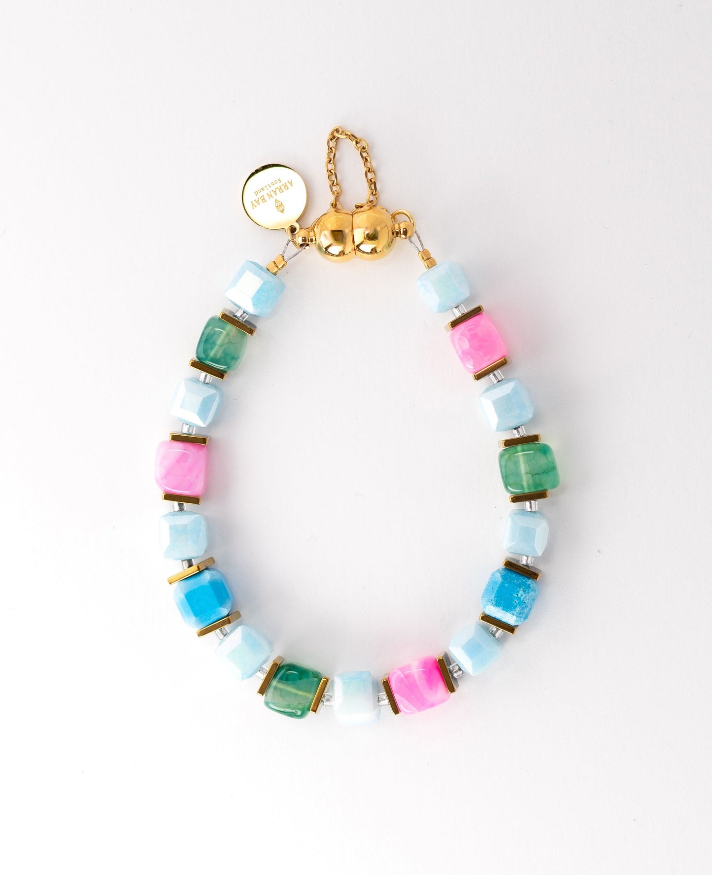 Multicolored beaded bracelet with a gold clasp on a white background