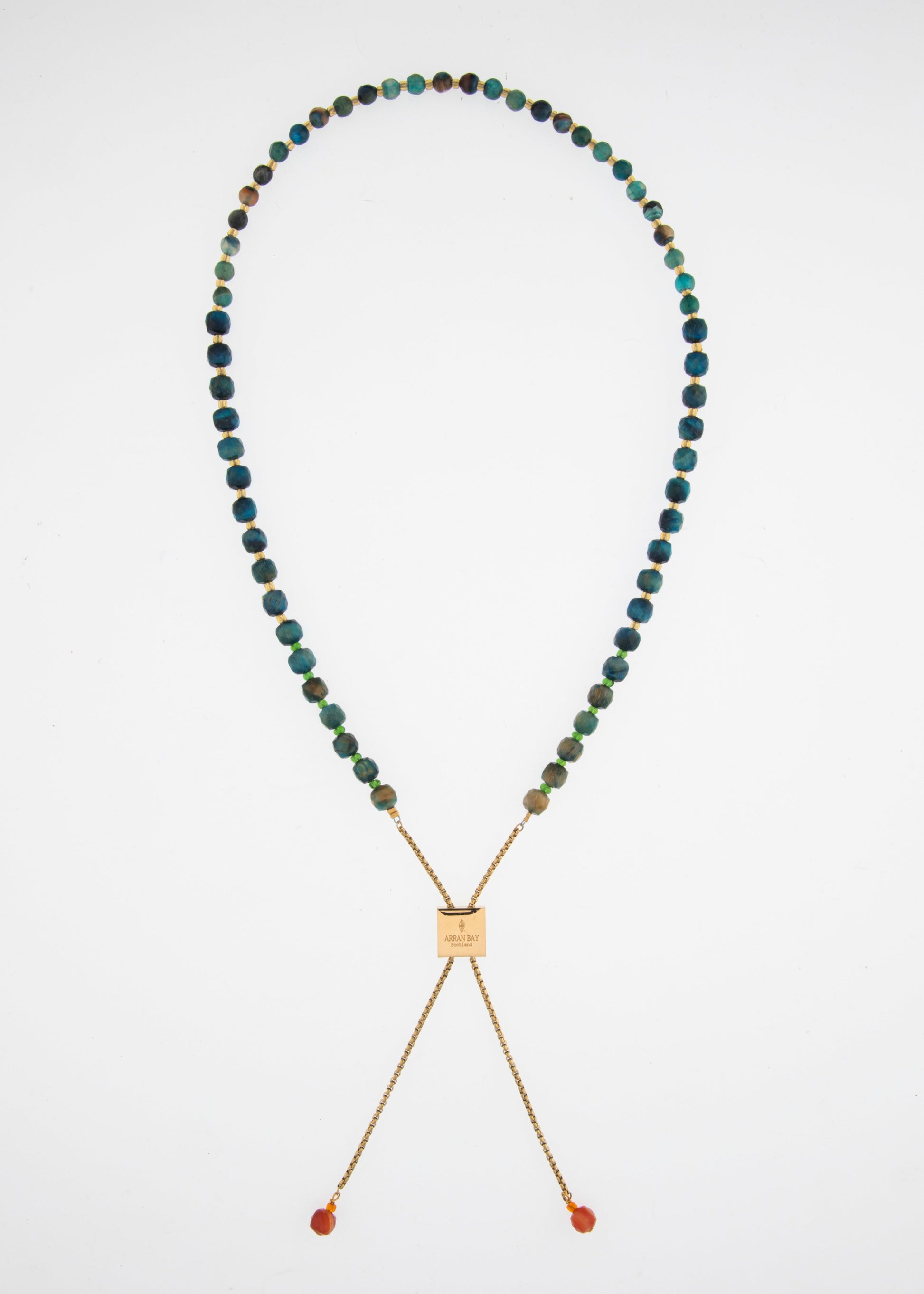 Necklace with multicolored beads and a gold clasp on a white background
