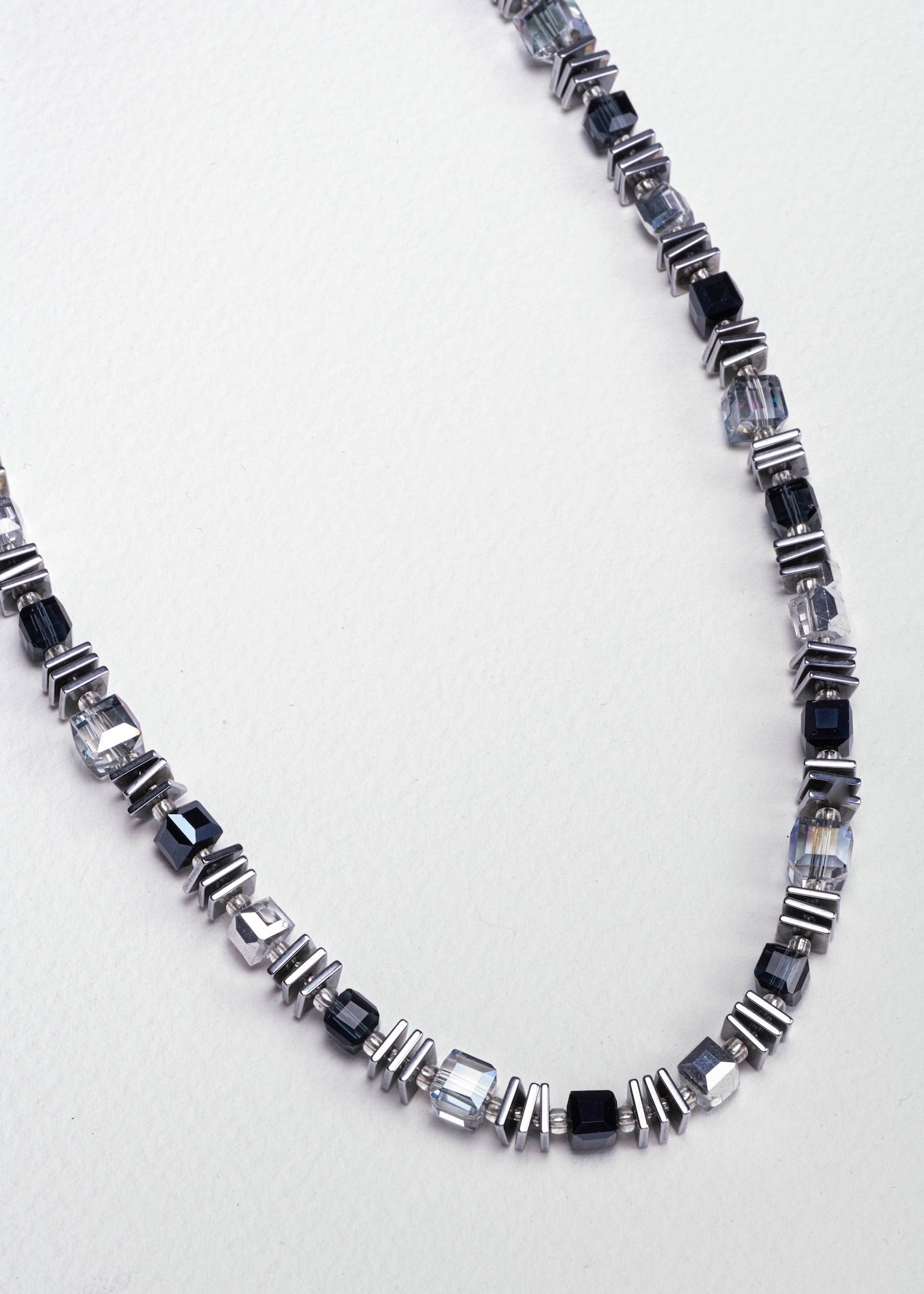Necklace with black and silver glass beads with slices of hematite