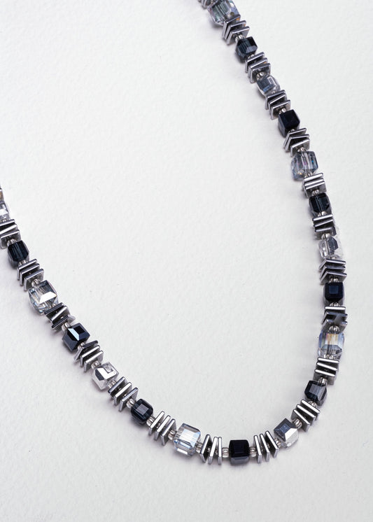 Necklace with black and silver glass beads with slices of hematite