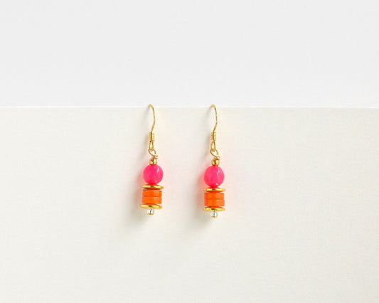 Pair of earrings with pink and orange beads on a white background